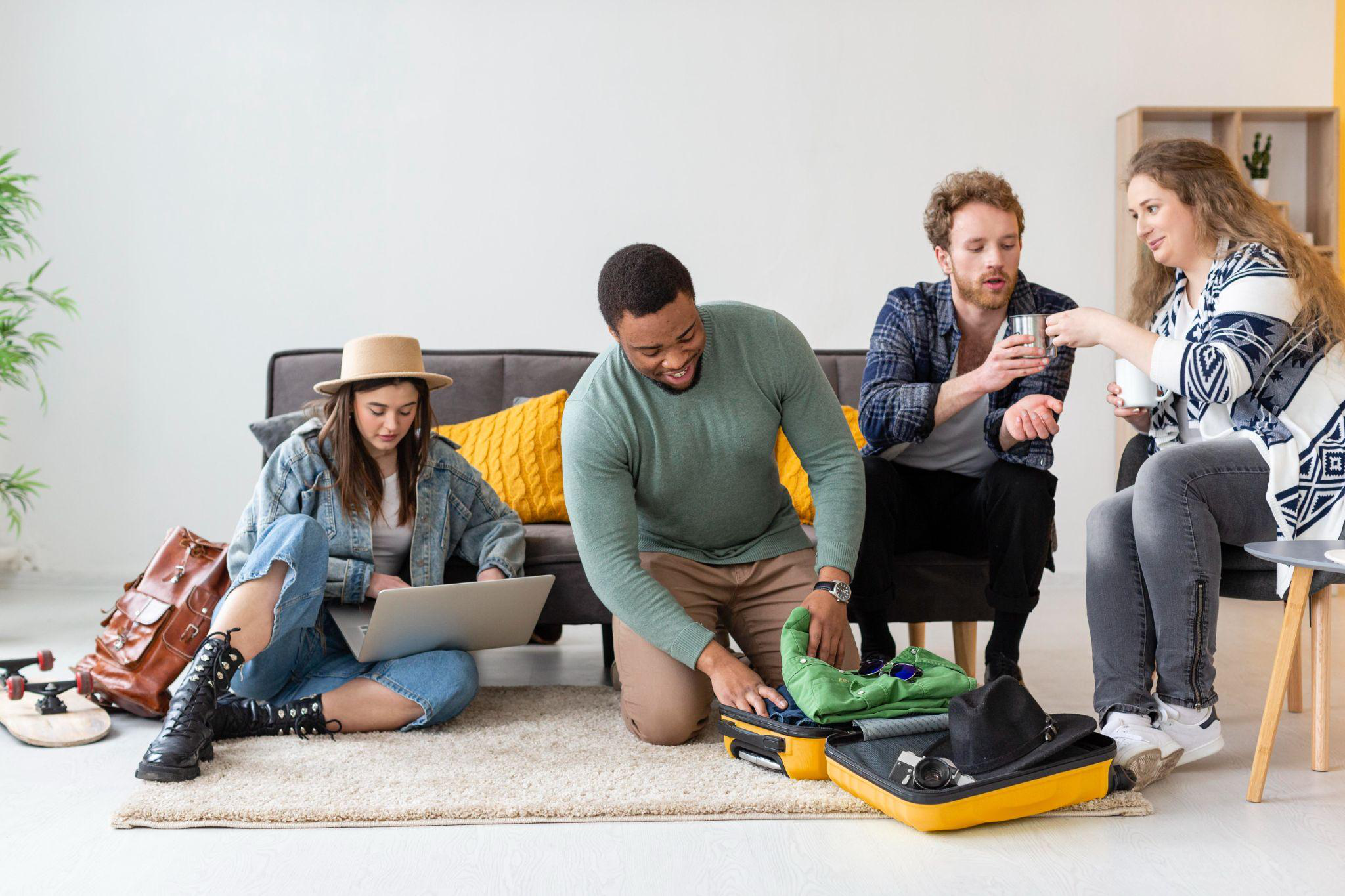A group of friends packing and organizing their luggage, excitedly preparing for a trip.