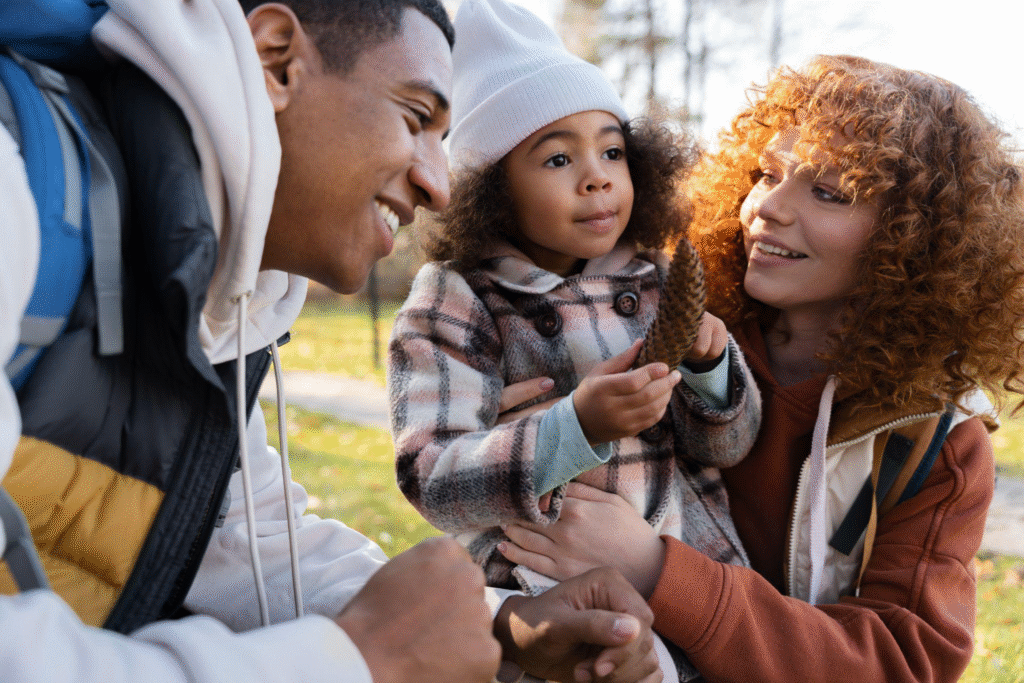 Family of three smiling and spending quality time together on a trip.
